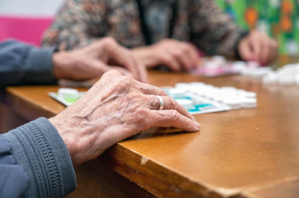 Close up of a senior residents playing bingo